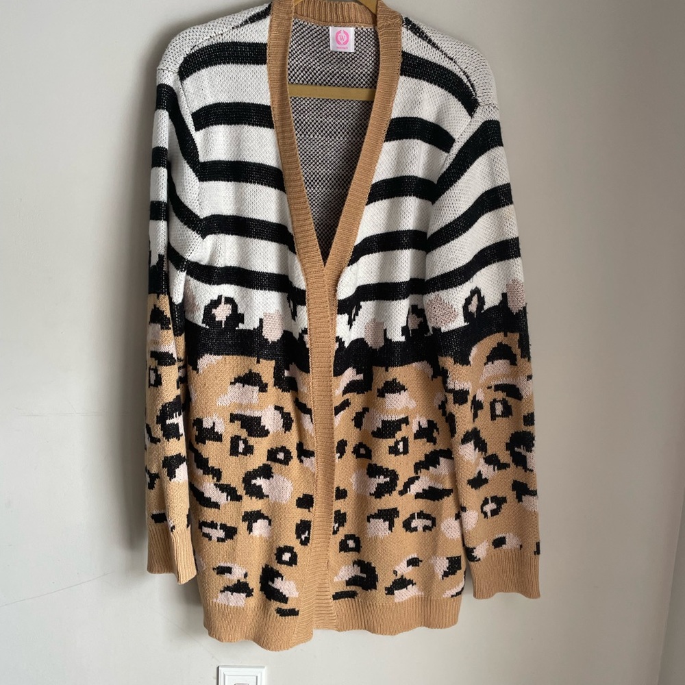Sweater long cardigan leopard print size large fits more like XL or XXL.